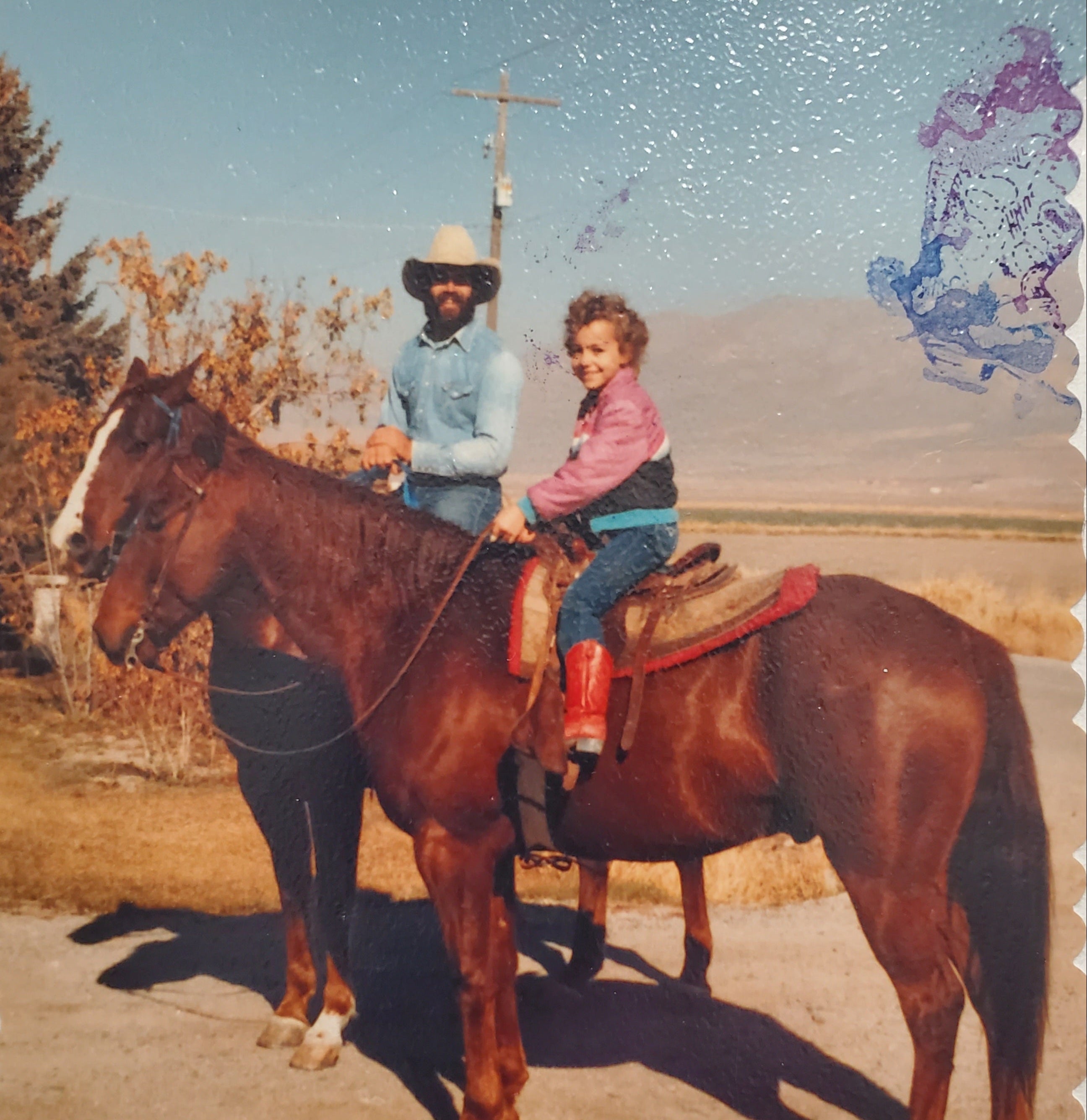 Young beef tallow maker and her dad riding horses outdoors